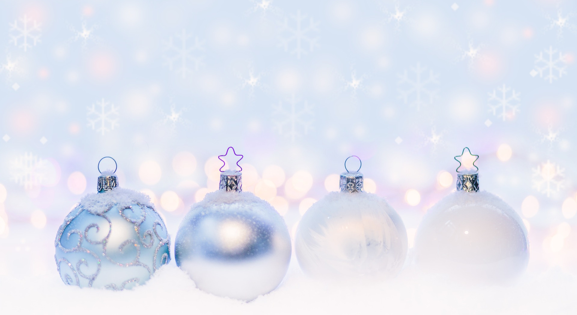 Place card photo of frosted silver and pale blue ornaments in snow